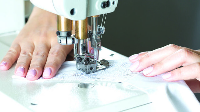 Lingerie panel under a sewing machine