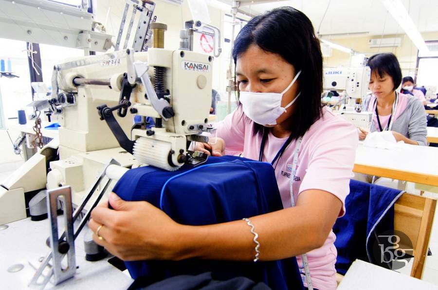 A lady working on a sewing machine