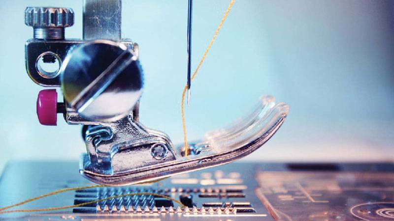 Image of the presser foot and needle of a sewing machine