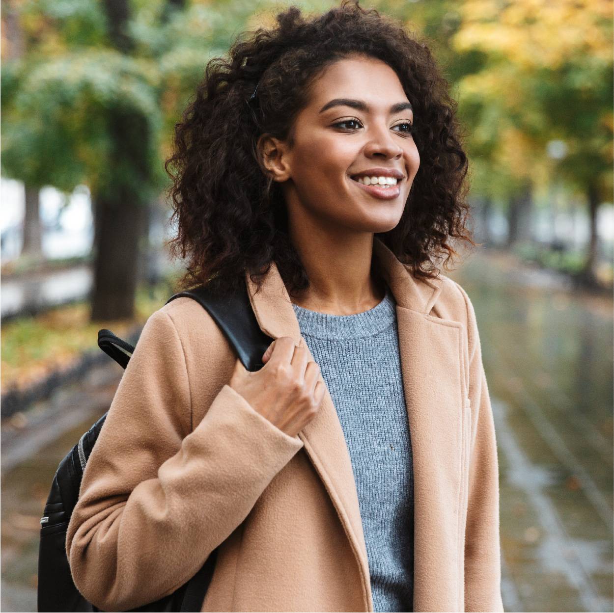 Female wearing coat in woods