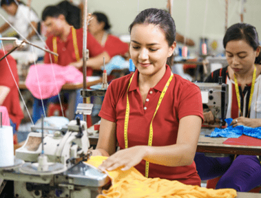 Portrait of professional Seamstress in textile factor
